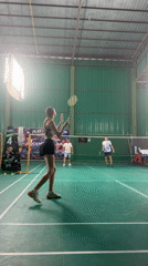 Indoor badminton in session at a Ko Samui sports facility