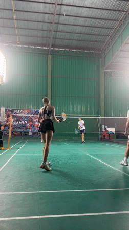 Indoor badminton in session at a Ko Samui sports facility