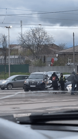 Wet streets, damaged buildings, traffic incident documented in Kharkiv