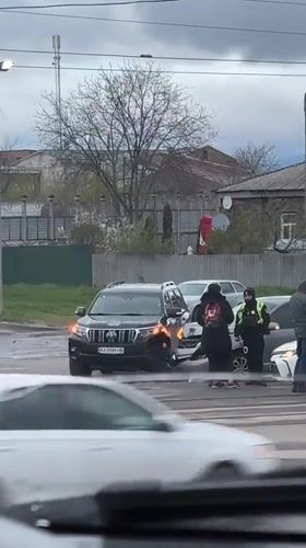 Wet streets, damaged buildings, traffic incident documented in Kharkiv