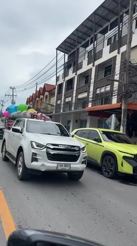 Balloon-decorated pickup truck spotted carrying blankets in Thailand