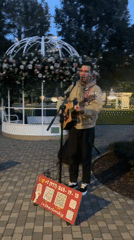 Acoustic guitar performance at dusk in Moscow