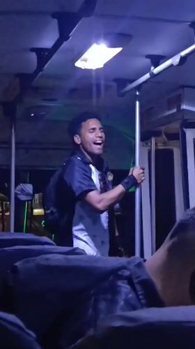 Man performs on bus in Porlamar, Venezuela