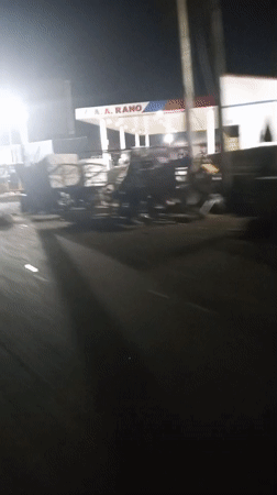 Nighttime street activity captured around Lokoja gas station