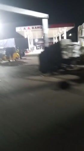 Nighttime street activity captured around Lokoja gas station