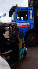 Crane truck operates on busy Jos street