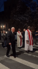 Religious procession observed on New York street at night