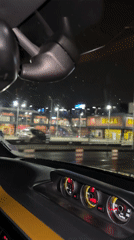 Rainy night drive past Billa store in Sofia