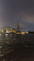 Peter and Paul Fortress lit up over the Neva at night