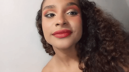 Woman records selfie video in Juan Griego, Venezuela