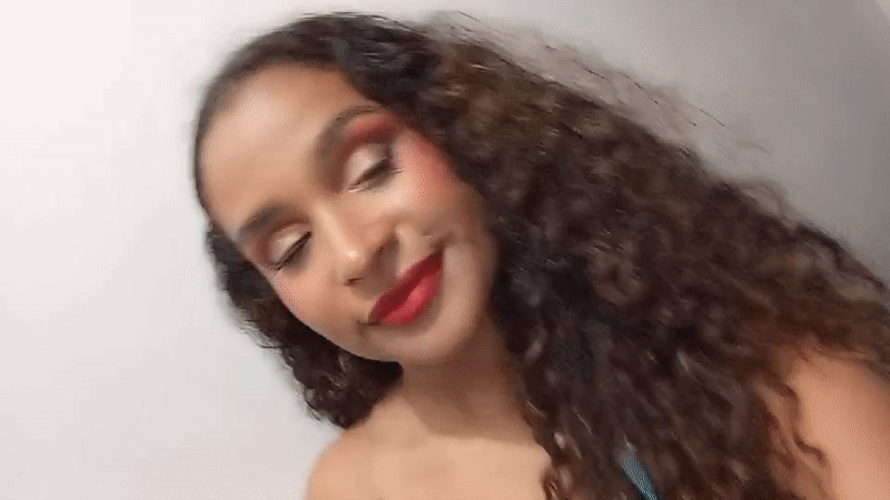 Woman records selfie video in Juan Griego, Venezuela