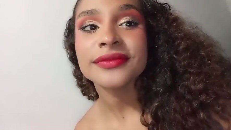 Woman records selfie video in Juan Griego, Venezuela