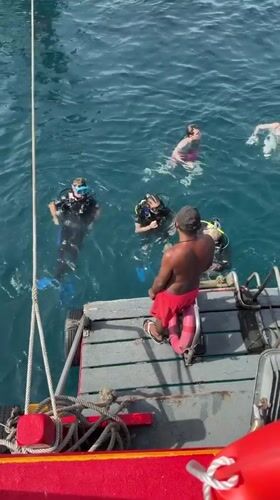 Divers in the water off Ko Tao on a calm morning
