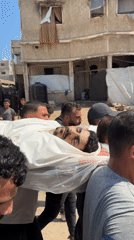 Body carried through Gaza streets amid street-level chaos