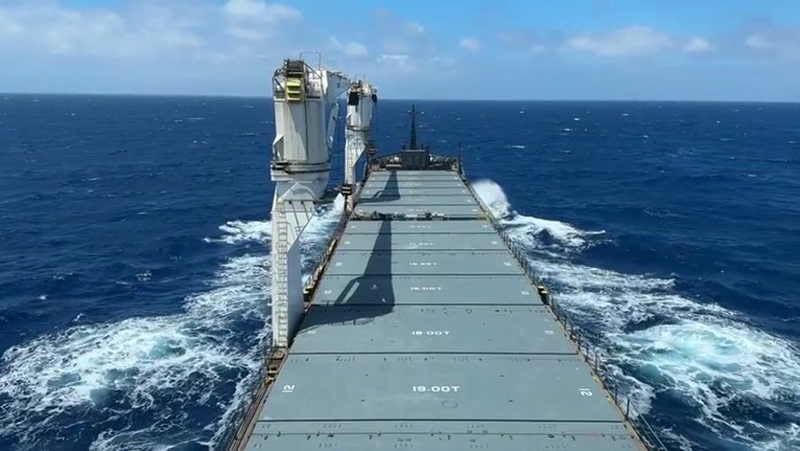 Cargo ship with cranes observed sailing Mediterranean waters
