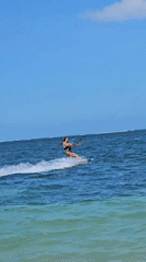 Kitesurfing session in clear Denpasar waters with jumps