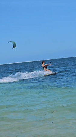 Kitesurfing session in clear Denpasar waters with jumps