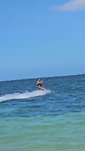 Kitesurfing session in clear Denpasar waters with jumps