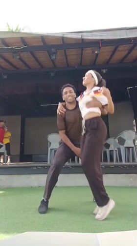 Outdoor dance performance near a stage in Porlamar, Venezuela