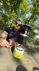 Couple prepares outdoor coffee with camping equipment in Slovakia