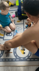Father and child play with toys in Sochi home