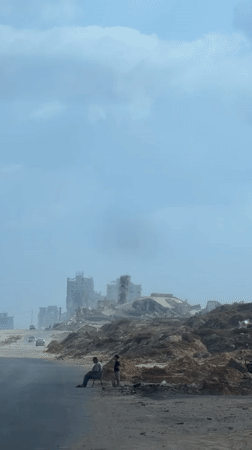 Street-level scenes from a heavily damaged Gaza neighborhood