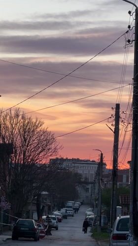 Sunset colors illuminate quiet street scene in Harmanli