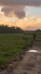 Rural dusk in Ahangama — paths, ponds, and fading light