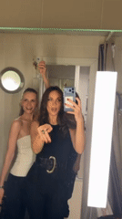 Women take selfies and group photos in Moscow locations
