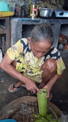 Elderly woman's morning routine documented in Baron, Indonesia home