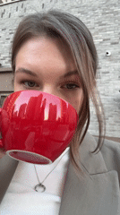 Woman enjoys coffee and meal at Belgrade café