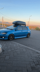 Two cars parked on roadside in Chernogorsk, Russia