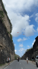 Paragliders, cliff roads, and coastal scenes in Kuta Selatan