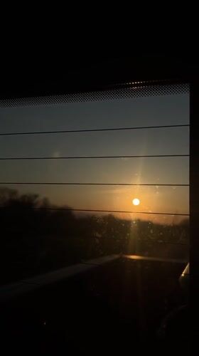 Sunset captured through vehicle window in Amsterdam, New York