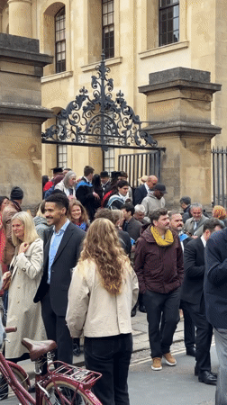 Graduation ceremony draws crowds near ornate gate in Oxford