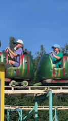 Caterpillar coaster ride on a sunny day in Kolpino