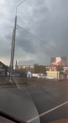 Rainy afternoon traffic captured in Klin, Russia