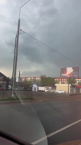 Rainy afternoon traffic captured in Klin, Russia