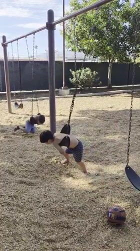 Kids playing at a Glendale playground on a summer evening