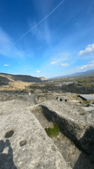 Aircraft contrail crosses clear Georgian sky near Kvakhvreli