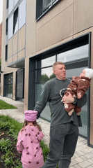Quiet moment with a baby outside a modern building in Perm