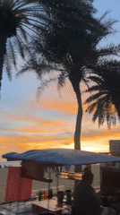 Pattaya beachfront sunset draws families, vendors during evening hours