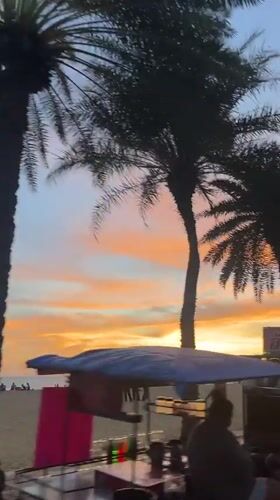 Pattaya beachfront sunset draws families, vendors during evening hours