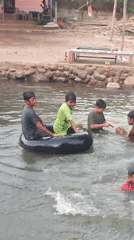 Children play in Saweuk river amid rural Indonesian village life