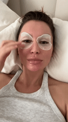 Woman's morning skincare routine captured in Moscow bedroom