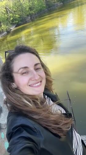 Woman photographed by water in Kryvyi Rih, Ukraine