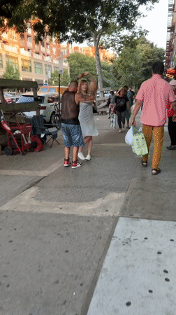 Sidewalk dancing and a deli food counter, Brooklyn.