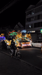 Illuminated Buddhist parade floats process through Đà Lạt streets