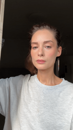 Woman enjoys banana pastry breakfast in Kiel kitchen