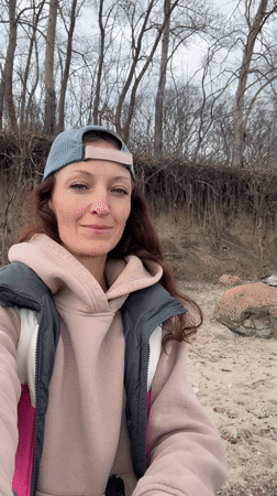 Woman visits Volga River shoreline in Ulyanovsk under cloudy skies